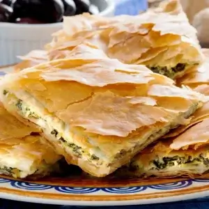 Spanakopita, Greek spinach pie with feta cheese and filo party | © jefftakespics2 / Alamy Stock Photo